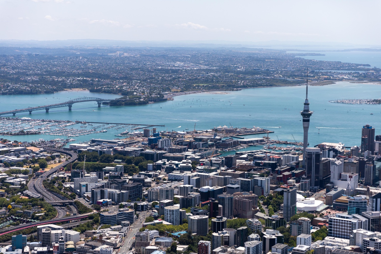 Auckland City Centre on sunny day with Skytower and Harbour Bridge